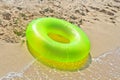 Green life buoy on beach