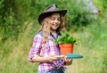 Green life. small girl farmer care about plant in pot. farming and agriculture. spring season. hellow summer. small girl