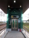 Green lift or elevator symbol at train platform 1.