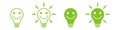 Green light bulb with a happy face. Green energy concept Royalty Free Stock Photo