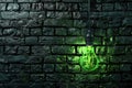 Green light is shining on a brick wall. Royalty Free Stock Photo