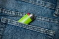 green lighter in blue jeans pocket Royalty Free Stock Photo