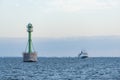 Green lighthouse in fairway Szczecin lagoon