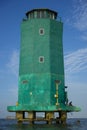 Green lighthouse in the middle of the sea of Sunda Kelapa