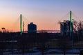 Green lighting of Bob Kerrey foot bridge with backdrop of River Front Condominiums Omaha Nebraska on St. Patrick`s Day