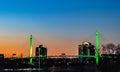 Green lighting of Bob Kerrey foot bridge with backdrop of River Front Condominiums Omaha Nebraska on St. Patrick`s Day