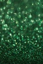 Green Lights Festive background with texture. Abstract Christmas twinkled bright bokeh defocused and Falling stars Royalty Free Stock Photo