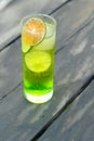 Green Lime alcohol drink cocktail with dried slice and ice Royalty Free Stock Photo