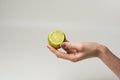 Green lime in a Female hand Royalty Free Stock Photo