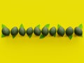 Green Lime group forming a line viewed from above with vibrant Yellow background in minimalism flatlay with copyspace Royalty Free Stock Photo