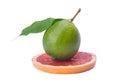 Green lime with leaf, on a grapefruit slice, on a white background Royalty Free Stock Photo