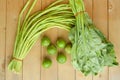 Green lime yardlong bean and kale on wood floor