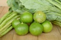 Green lime yardlong bean and kale on wood floor