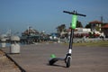 A green Limebike Lime-S electric scooter in downtown San Diego
