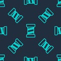 Green line Sewing thread on spool icon isolated seamless pattern on blue background. Yarn spool. Thread bobbin. Vector Royalty Free Stock Photo