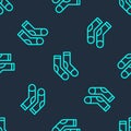 Green line Socks icon isolated seamless pattern on blue background. Vector Royalty Free Stock Photo