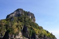 Green-lined mountain against the sky