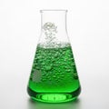 Green liquid bubbling in a conical flask isolated on white background Royalty Free Stock Photo