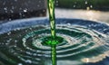 A green liquid pours into a blue bowl, a simple yet intriguing scene Royalty Free Stock Photo