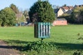 Green litter bin with graffiti Royalty Free Stock Photo