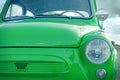 Green little retro car. retro car concept. view of the front of the car Royalty Free Stock Photo