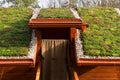 Green living roof on wooden building covered with vegetation Royalty Free Stock Photo