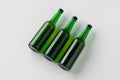 Green longneck beer bottle mockup. Three bottles