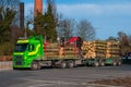 Green lorry transporting logs