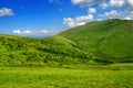 Green lush mountain valley with pathway Royalty Free Stock Photo