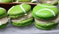 Green macarons appetizers filled with vanilla ice cream on crystal glass dish Royalty Free Stock Photo