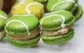 Green macarons appetizers filled with vanilla ice cream on crystal glass dish Royalty Free Stock Photo