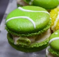 Green macarons hor` d`oeuvres filled with vanilla ice cream on crystal glass dish Royalty Free Stock Photo