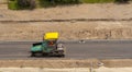 Road building . Pouring asphalt pavement. Royalty Free Stock Photo