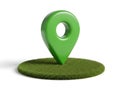 Green map marker pin on grassy patch isolated on white background Royalty Free Stock Photo