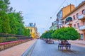 Green maples and benhes on Kobylyanska Street, on July 16 in Chernivtsi, Ukraine