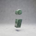 Green marble semicolon symbol on concrete background