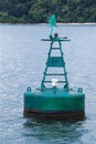 Green Marker Buoy at Sea