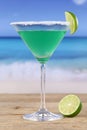 Green Martini Cocktail on the beach Royalty Free Stock Photo