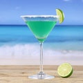 Green Martini cocktail drink on the beach Royalty Free Stock Photo
