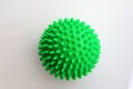 Green massage sport ball on a white background