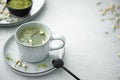 green matcha in a gray ceramic cup