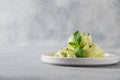 Green matcha ice cream and mint on grey table. Horizontal orientation. Space for text Royalty Free Stock Photo