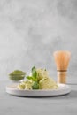 Green matcha ice cream and mint on grey table Royalty Free Stock Photo