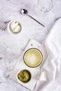 Green matcha ice tea with cream cheese in a glass. Trendy homemade drink. Top and vertical view Royalty Free Stock Photo