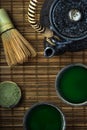 Green matcha tea ceremony. Bamboo background, top down view