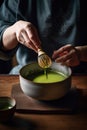 Green matcha tea, culture of Japan and China. Hands make matcha, stir tea in a large bowl with a whisk for matcha. Generative AI