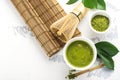 Green matcha tea drink and tea accessories on white background Royalty Free Stock Photo