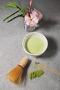 Green matcha tea drink and tea accessories on white background. Japanese tea ceremony concept, top view Royalty Free Stock Photo