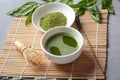 Green matcha tea drink and tea accessories on white background. Royalty Free Stock Photo