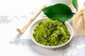 Green matcha tea powder and tea accessories on white background Royalty Free Stock Photo
